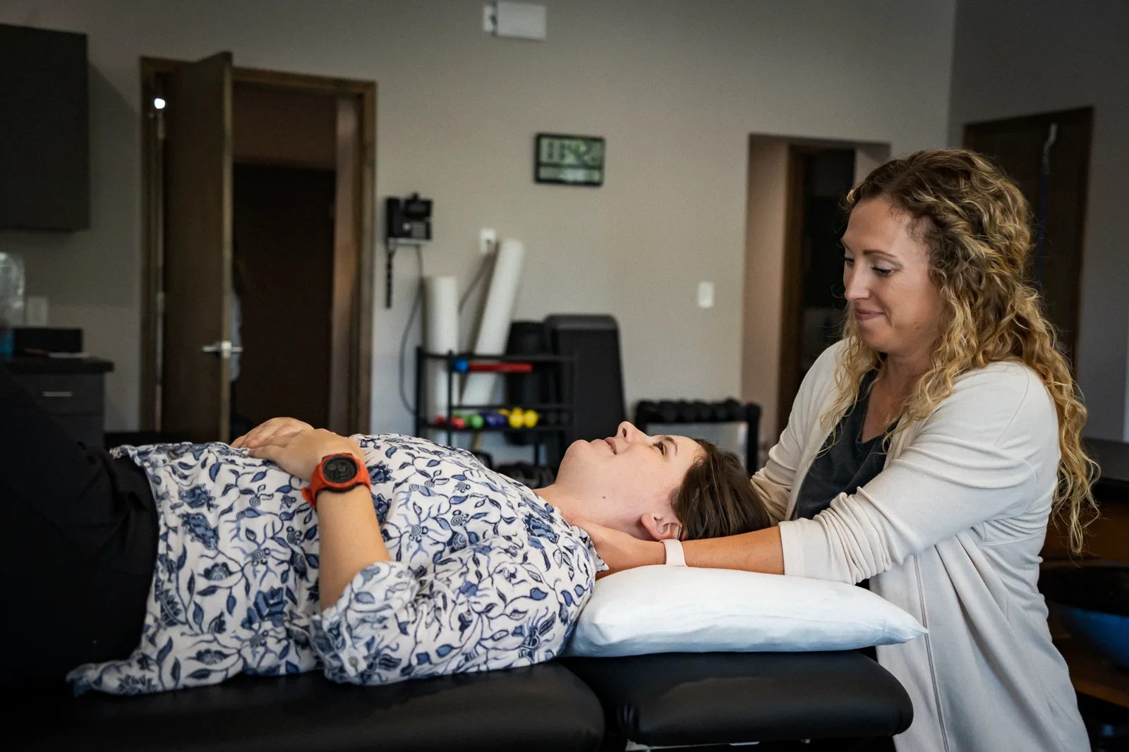 A therapist treating a patient in the clinic at IRG Physical Therapy